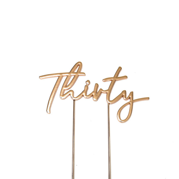 Metal cake topper with the word Thirty in Rose Gold