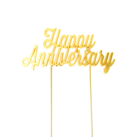 Metal cake topper with the words Happy Anniversary in Gold