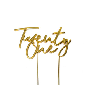Metal cake topper with the words Twenty One in Gold
